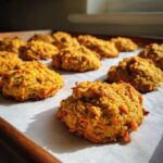 A tray of homemade Carrot Apple Crunchies for Dogs, baked to a golden brown and ready to be enjoyed.