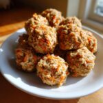 A plate of freshly baked Soft Carrot Peanut Butter Dog Treats, golden brown and ready to be enjoyed.