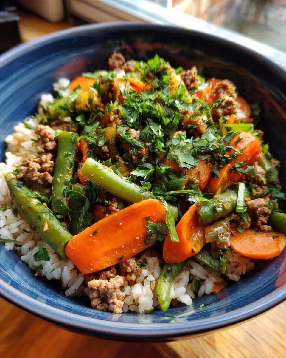 A delicious Fresh Veggie & Beef Dog Bowl with rice, carrots, green beans, and parsley.