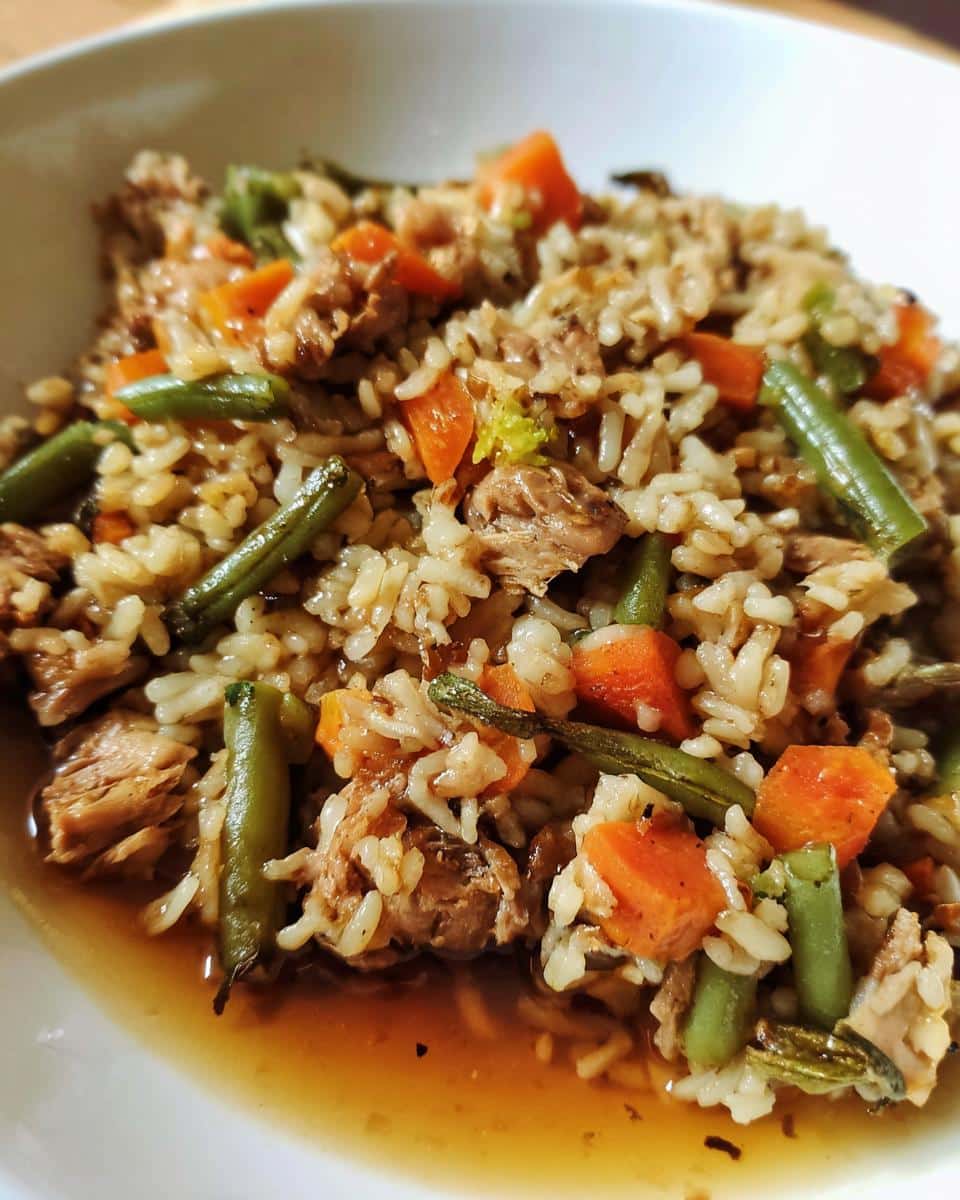 A bowl of Large Dog Chicken Liver & Rice Dinner, featuring rice, chicken, green beans, and carrots.