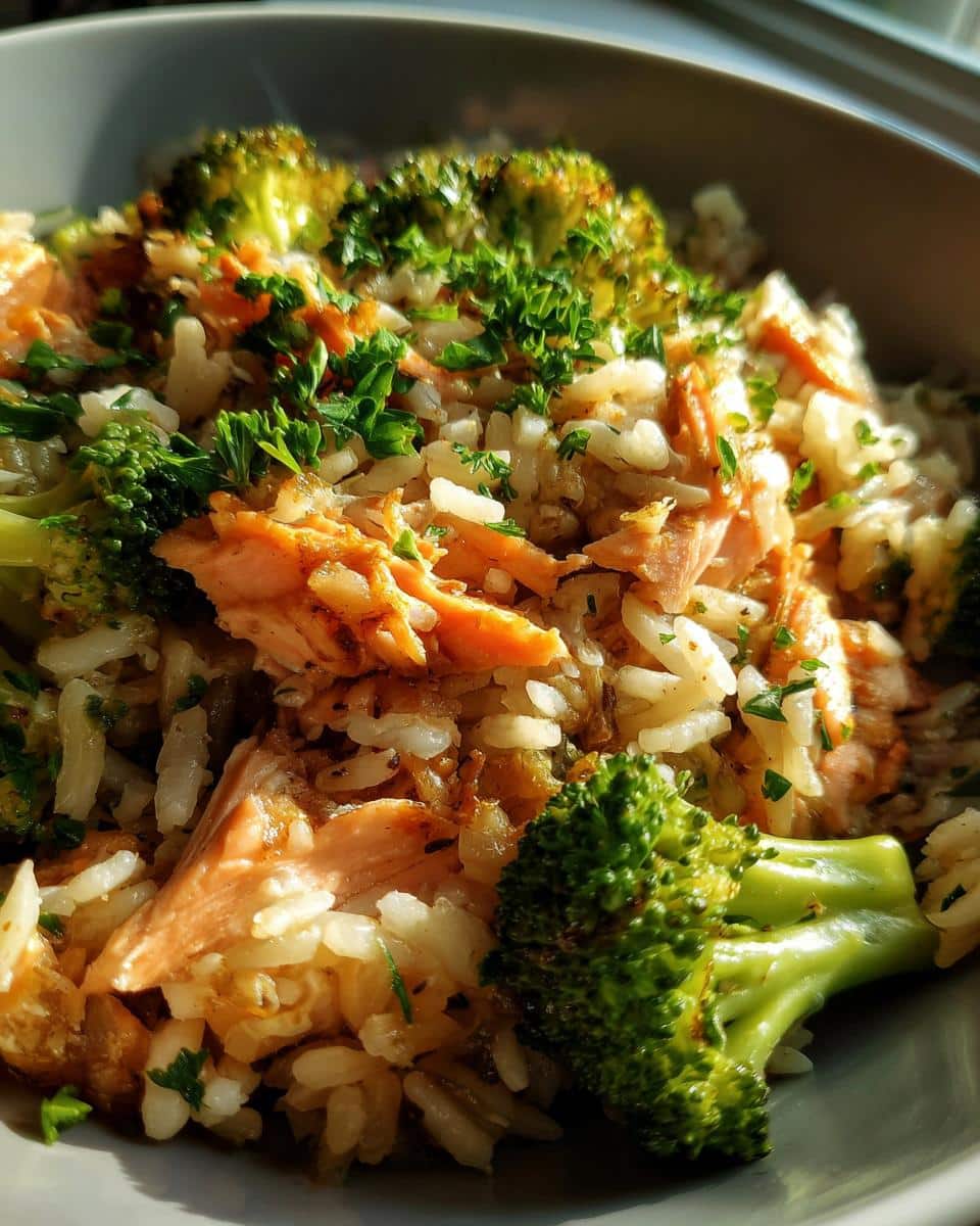A bowl of Simple Salmon & Broccoli Dog Food, featuring salmon, broccoli, rice, and parsley.